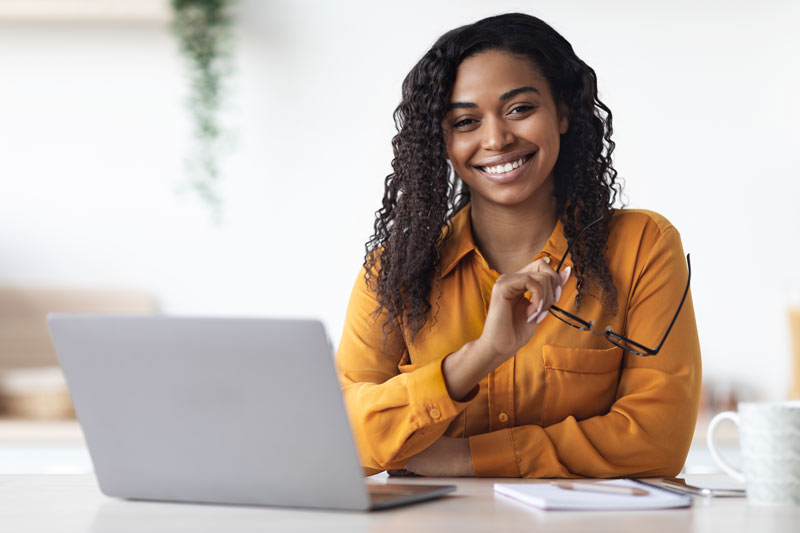 Happy woman at a laptop