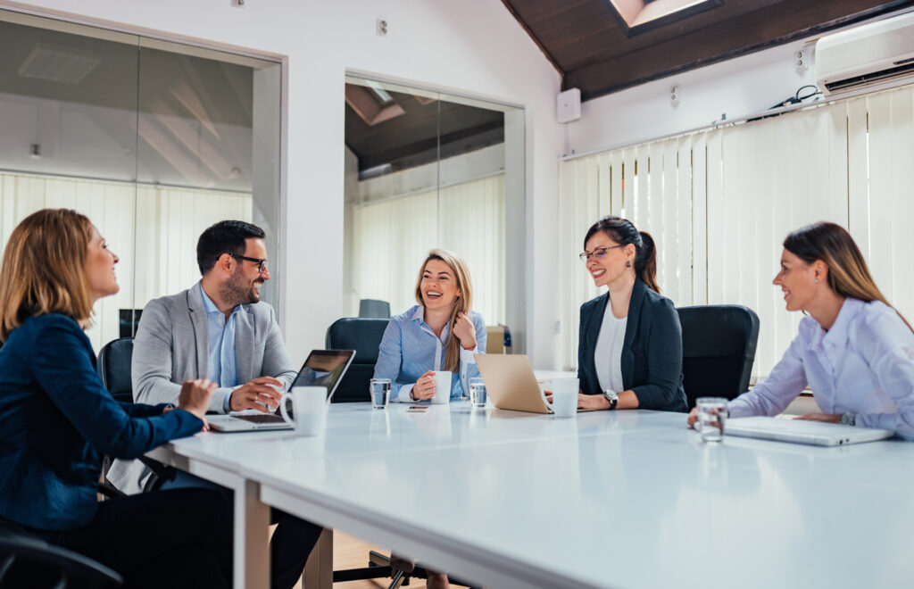 A group of professionals collaborating at a conference table.